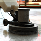 Janitor waxing floor with machine